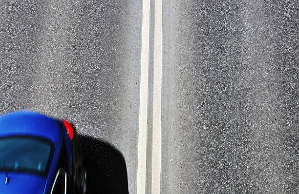 istock Silhouette of a car on the highway 593328840