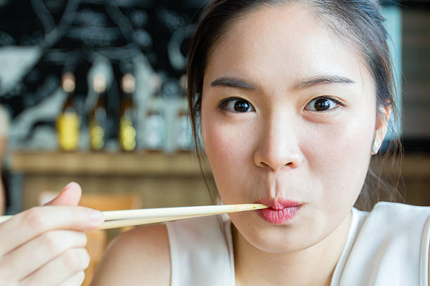 Woman eating sushi