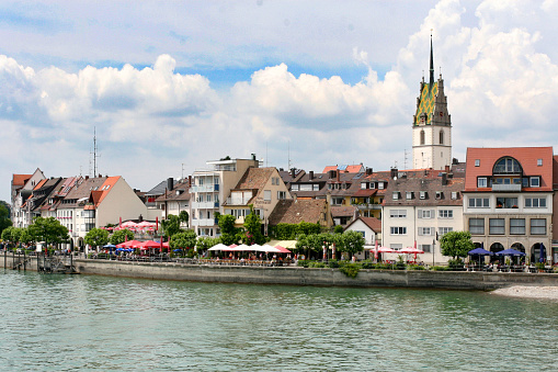 Friedrichshafen, Germany - June 29, 2005: Shoreline of the town of Friedrichshafen on Lake Constance seen from the ferry coming in to dock from Romanshorn, Switzerland. 