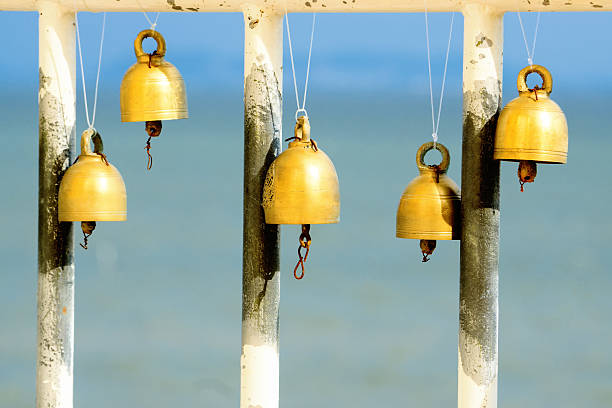 istock Small Golden bells are hanging in buddhist temple 593332116