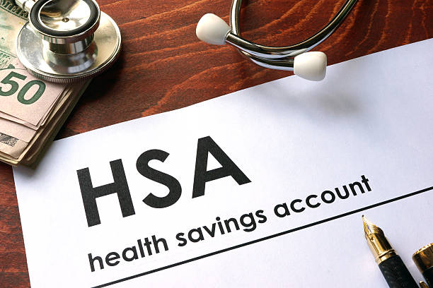 istock Paper with words  health savings account (HSA) on a table. 593332270