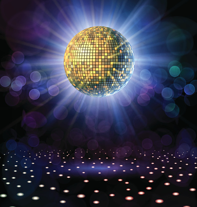 Disco ball with rays in a nightclub.