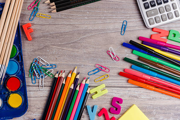 istock School supplies on wood background 593333546