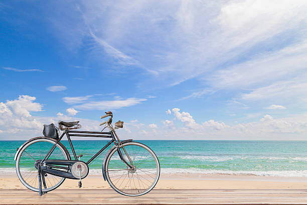 istock Old  bicycle  on wood with Turquoise sea , 593333616