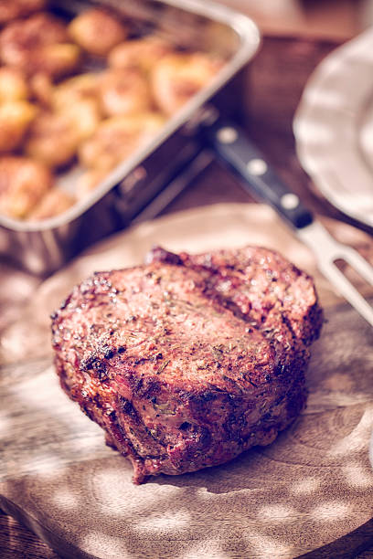 istock Eating Roast Beef with Potatoes and Root Vegetables 593333700
