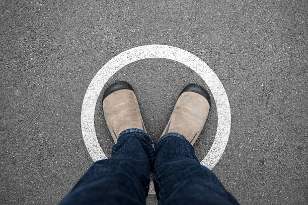 istock Man standing in white circle on the floor 593334106