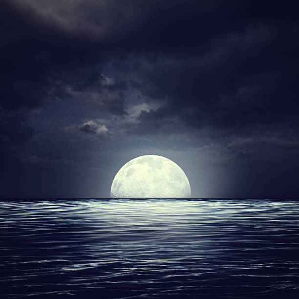 istock Sea surface under night stormy skies, abstract natural backgroun 593336026