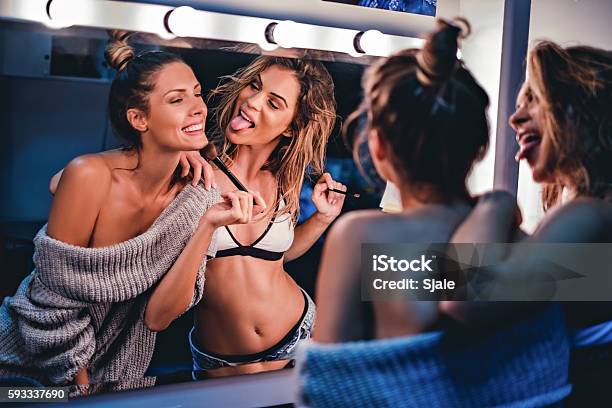 Girlfriends Putting Makeup And Having Fun Stock Photo - Download Image Now - Friendship, Make-Up, Cheerful