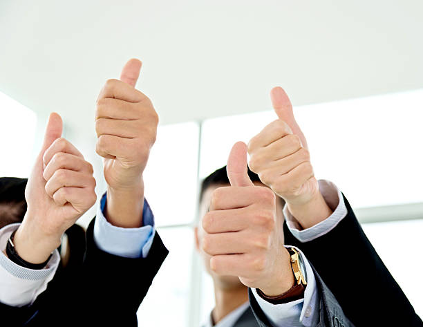 istock Business colleagues showing thumb up 593338198