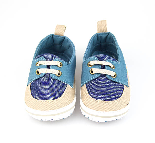 istock baby shoes isolated on white background 593338492
