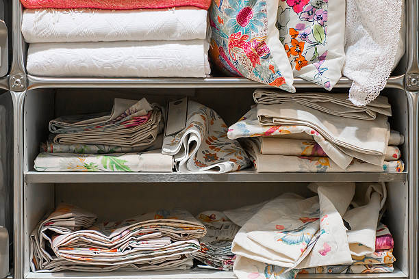 istock Pile of folded baby blankets and sheets, close-up 593340260