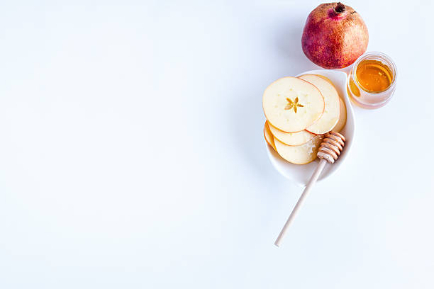 istock Apples, pomegranate and honey for Rosh Hashanah 594014394
