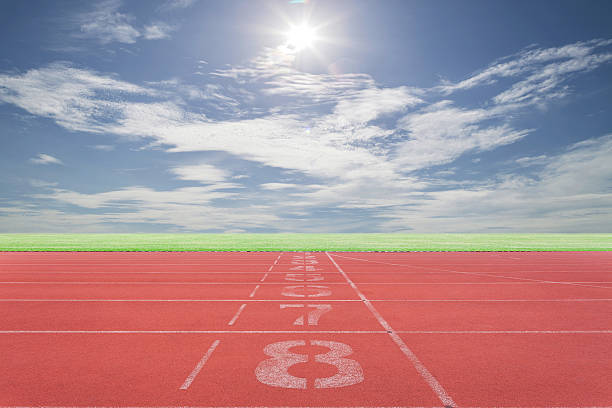 istock Athletic track lane number with Running track green grass 594014424