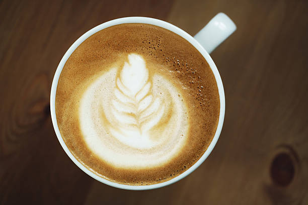 istock fresh hot cup of coffe with latte art 594014572