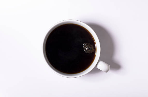istock cup of black coffee from above against white with shadow. 594015252