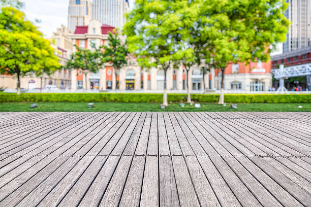 istock empty wooden floor with modern building in city 594015258