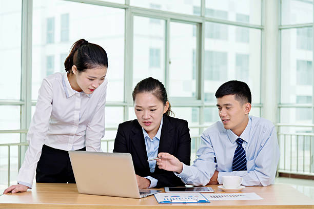 istock Business people working on laptop together 594015374