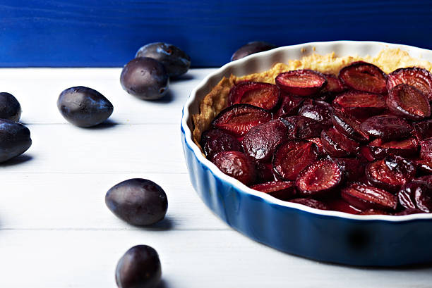 istock Homemade pie with plums on the table 594015600