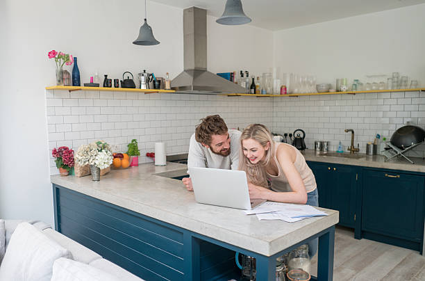 istock Young couple social networking at home 594015690
