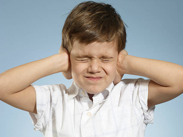 istock little Boy closing his ears 594016450