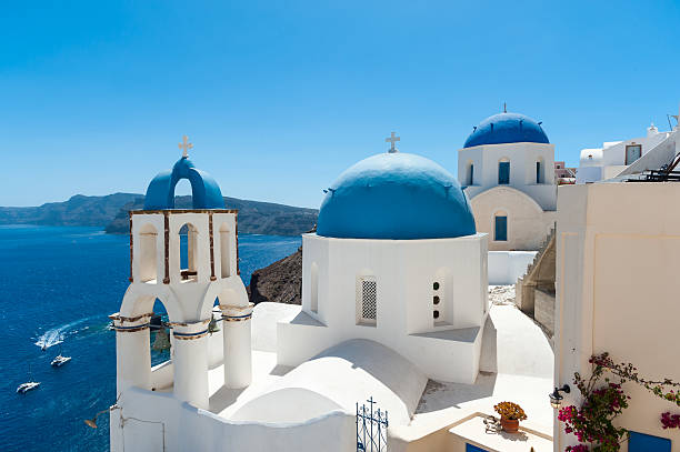 istock White and blue Santorini - view of caldera with domes 594016454