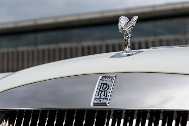 Rolls-Royce Ghost in front of the Goodwood plant Westhampnett, United Kingdom - August 11, 2016: Rolls-Royce Ghost stands in front of the Goodwood car factory. Ghost remains one of four Rolls-Royce models while company develops its first SUV. rolls royce stock pictures, royalty-free photos & images