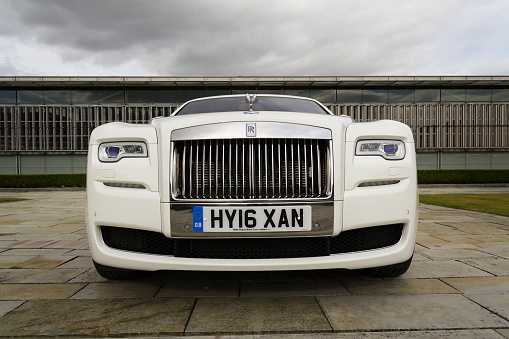 Westhampnett, United Kingdom - August 11, 2016: Rolls-Royce Ghost stands in front of the Goodwood car factory. Ghost remains one of four Rolls-Royce models while company develops its first SUV.