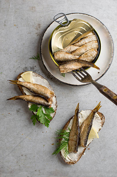 istock Sprats or sardines in can and sandwiches 594018936