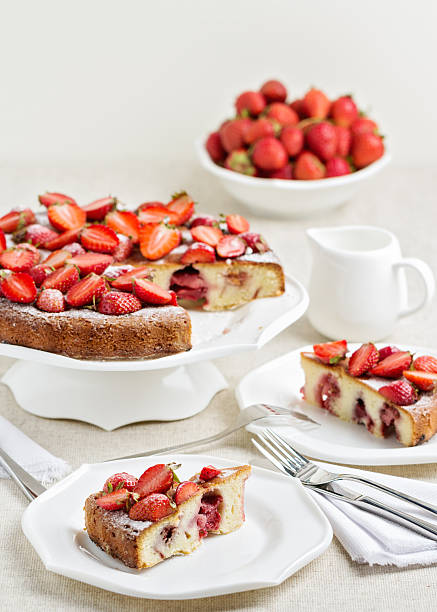istock Homemade strawberry cake on a white cake stand. 594019172