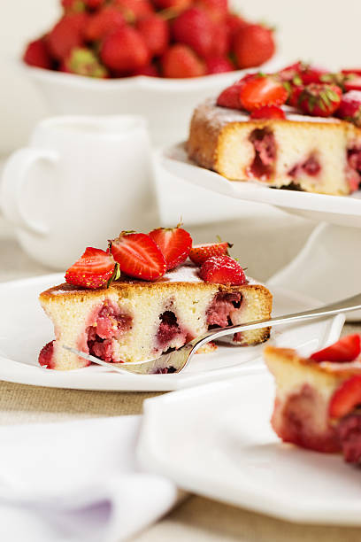 istock Homemade strawberry cake on a white cake stand. 594019324