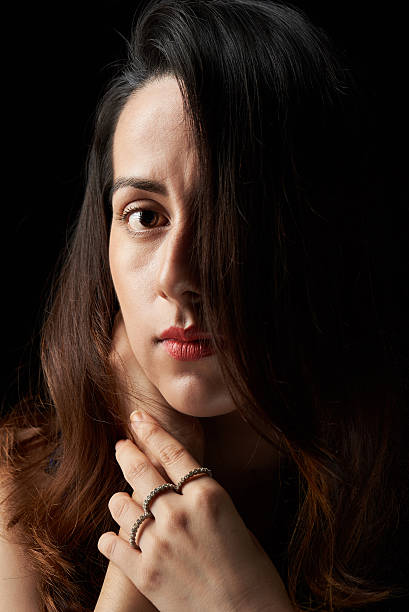 istock woman face covered with hair 594020354