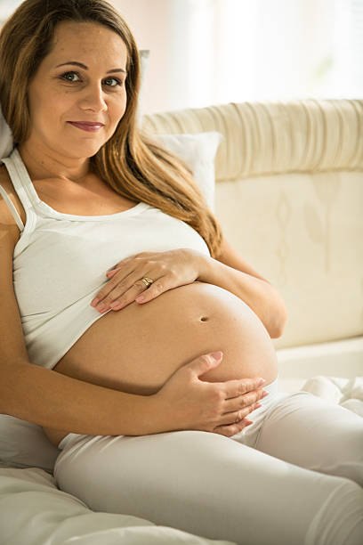 istock Pregnant woman smiling 594020726