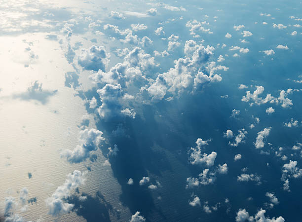 Aerial view of seascape Aerial view of seascape with clouds over it above cloud stock pictures, royalty-free photos & images