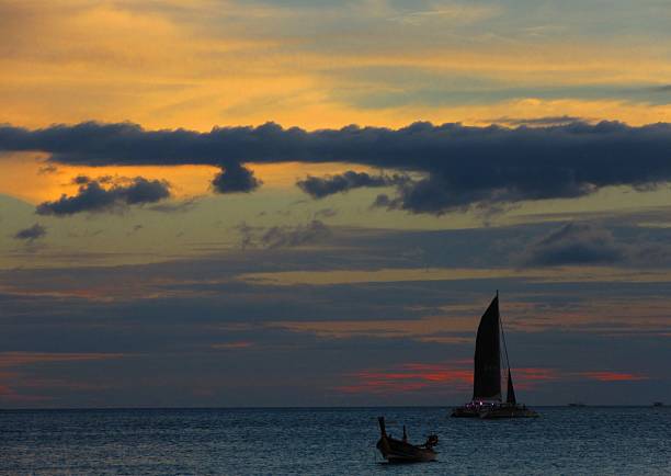 Sailboat Silhouette at Sunset stock photo