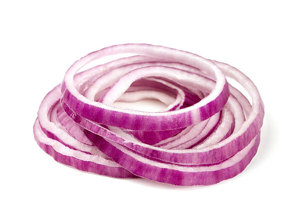 slices of red onion isolated on white stock photo