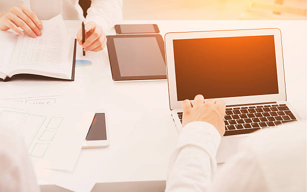 istock View of table with gadgets in office 594031692