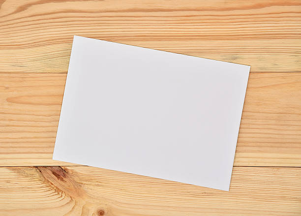 istock paper on wooden table 594033626