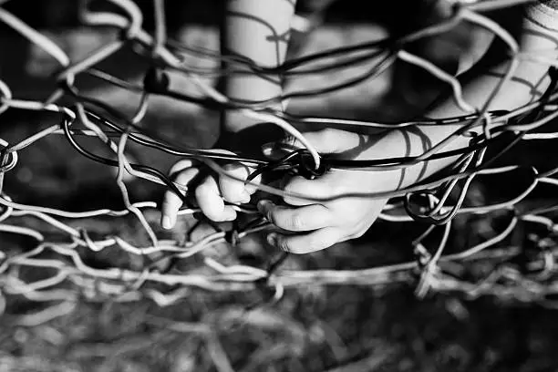 Broken metal mesh. Black and white image.