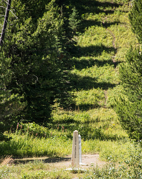 istock USA  and Canada boundary as viewed with from Waterton Lake 594035206