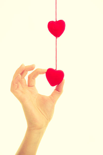 istock Female hand with little hearts. 594036272