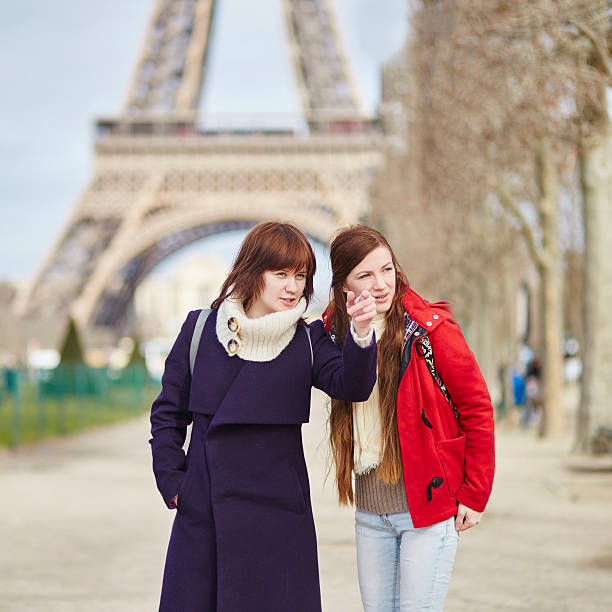 istock Two girls in Paris near the Eiffel tower 594038272