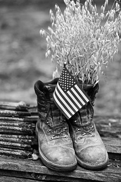 istock Farmer's Old Leather Work Boots with Flag and Oats 594038884
