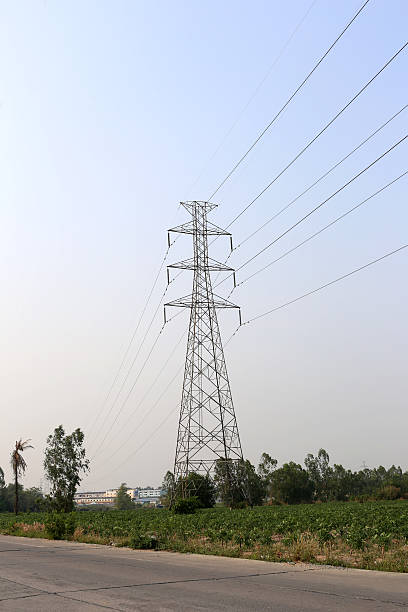 istock High voltage poles on sky background in rural areas. 594039946