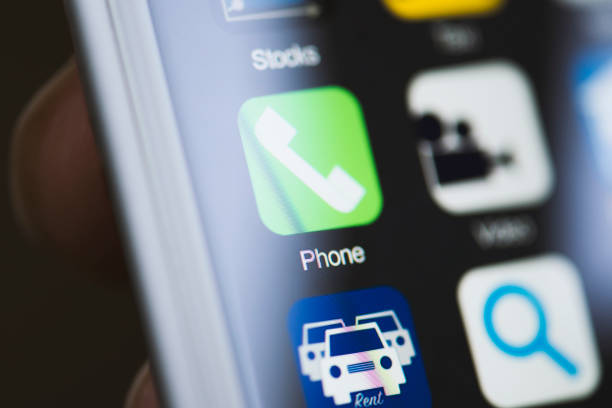 istock Hand holding phone, phone app on screen 594040816