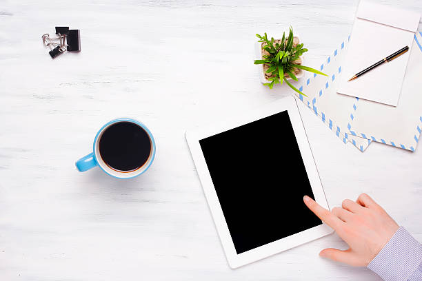 istock Top view of business man pointing something in a tablet. 594041784