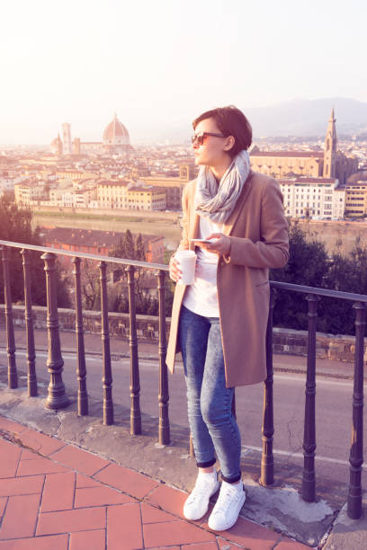 istock Young woman using smartphone in the city 594042500