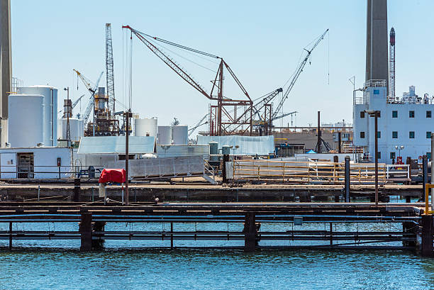 istock loading or discharging tower crane at a sea port 594042908