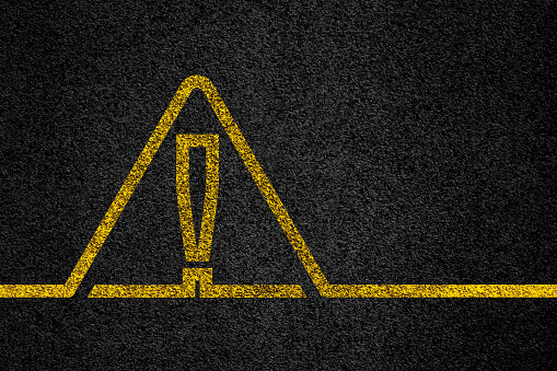 Warning symbol on road floor