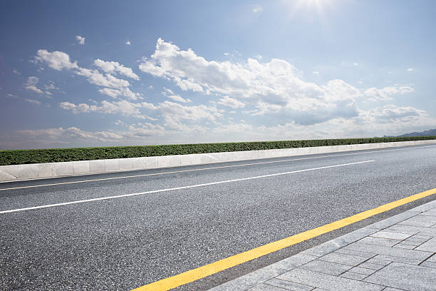 istock empty rural asphalt road in sunny day 594045370