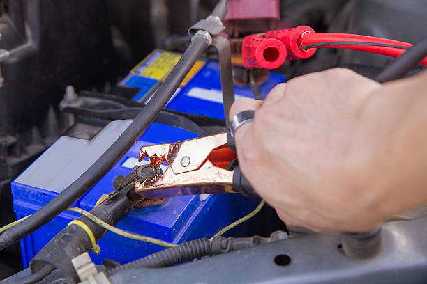 istock Jumping the battery / charging car battery 594049224